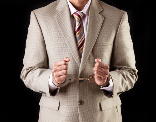 Businessman in handcuffs