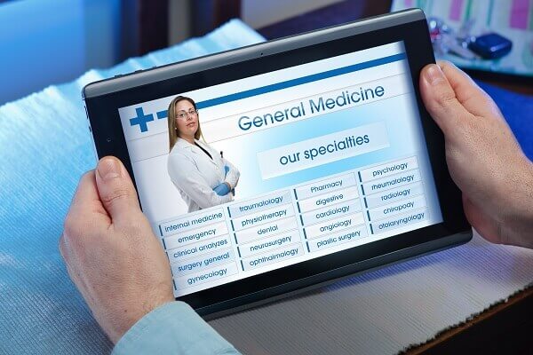 looking up health care options on tablet